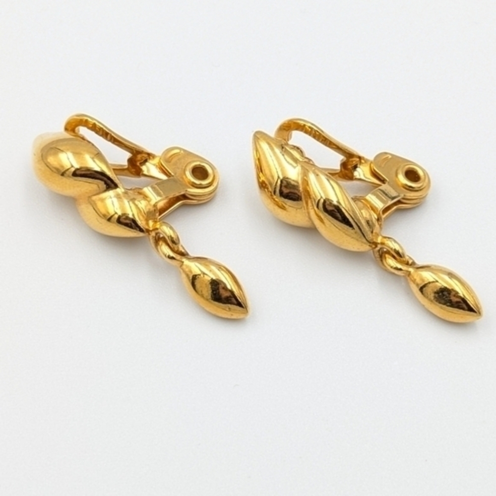 Vintage signed Monet gold tone clip on earrings